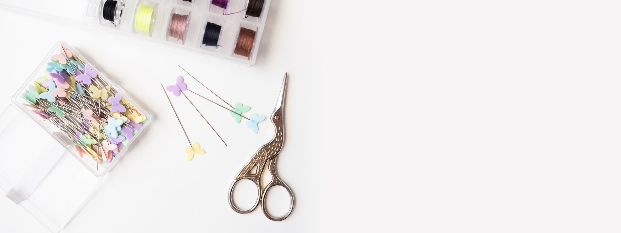 Studio table with embroidered samples and tools