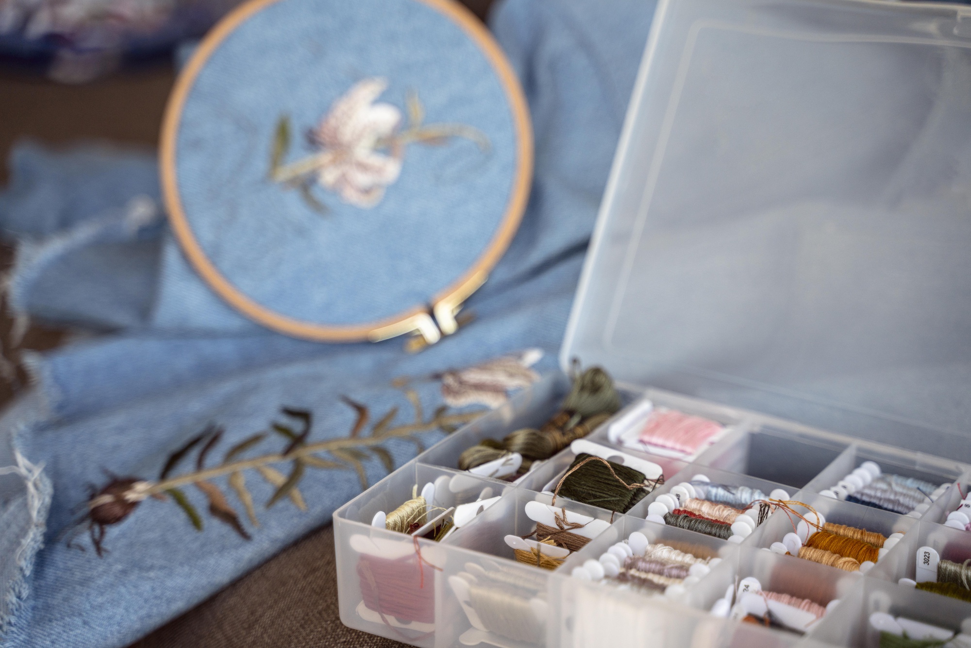 Assorted embroidered samples on table